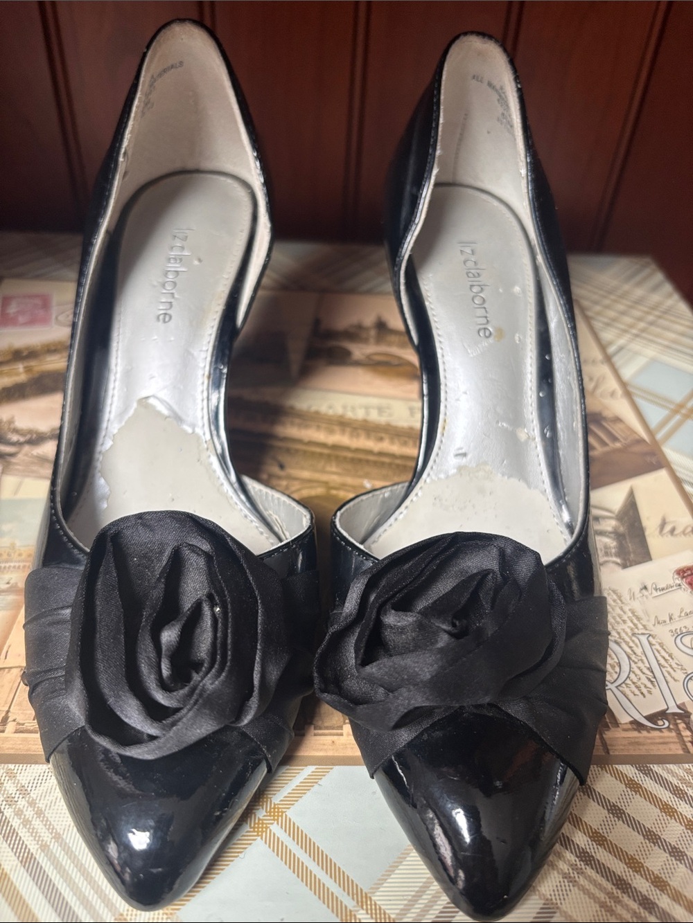Liz Claiborne black patent leather pumps showcase a sophisticated d'Orsay